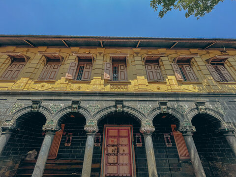 Historic traditional Wada-style architecture in Trimbakeshwar, Maharashtra, featuring carved stone pillars, wooden windows, and old temple-town charm.