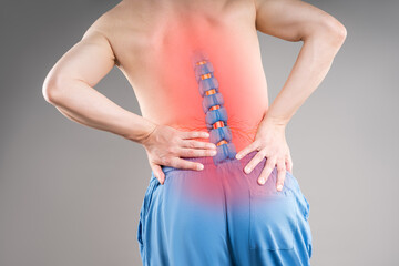 Lumbar intervertebral spine hernia, sciatica, man with back pain, spinal disc disease