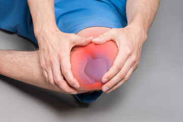 Knee pain, joint inflammation, arthritis and degenerative changes, man suffering from leg ache and doing self-massage