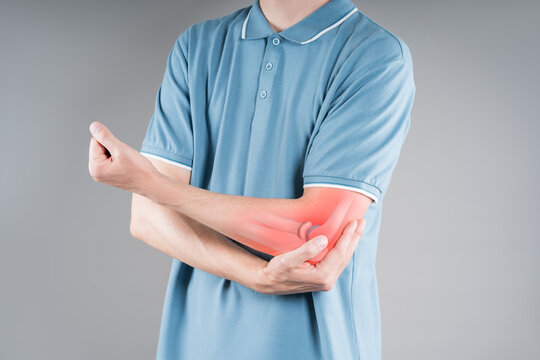 Diseases of the elbow joint, bone fracture and inflammation, man suffering from pain in cubit