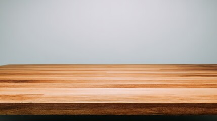 overhead. Minimalist wooden desk in a cozy living room, softly lit for a clean and uncluttered aesthetic. lifestyle magazines.