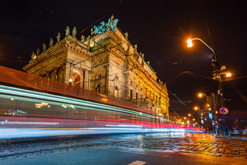 Light trails of tram next to the National Theatre in UNESCO world heritage site city Prague in night. 