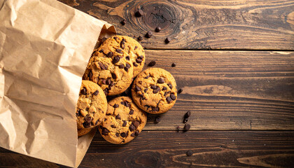 Chocolate chip cookies on a paper bag over, copy space  