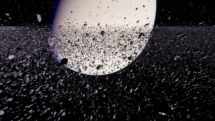 Saturn is prominently displayed in the vastness of space, surrounded by its iconic rings and numerous icy particles reflecting light. This captivating view showcases the beauty of the planet.