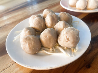 Thai pork meatballs on wood background