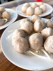 Thai pork meatballs on wood background top view.