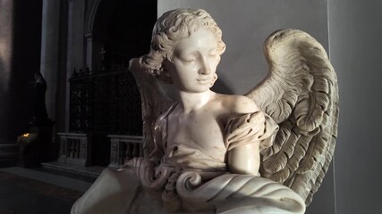 A graceful female angel sculpture stands as a timeless symbol of serenity