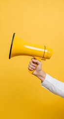 Hand Holding Yellow Megaphone on Clean White Background