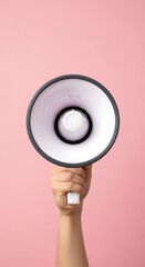 Hand Holding White Megaphone on Clean Pink Background