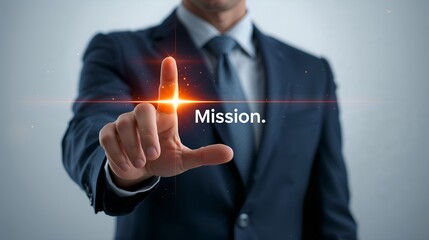 a businessman in a suit pointing his finger towards the word Mission. illuminated text, innovation, leadership, vision and futuristic concepts