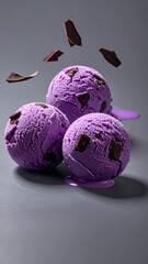 Delicious Lavender Ice Cream: Three vibrant scoops of lavender ice cream with rich chocolate pieces create a delightful sensory experience.  A cool and sweet treat.
