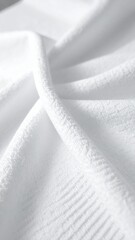 Soft and Serene Texture: A close-up study unveils the gentle, inviting texture of a soft, white fabric. It offers a sense of tranquility. 