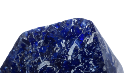 Raw blue sapphire gemstone on the transparent background  closeup of natural crystal structure and deep blue color for jewelry and mineral collections