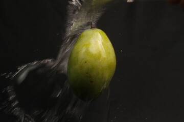 green apple with water drops