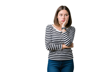 Frustrated young woman in black and white striped shirt, resting chin on hand with a bored and pensive expression, looking to the side, isolated on transparent background.