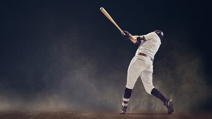 Baseball batter full follow-through swing on dusty field showing kinetic power. Concept of motion dynamics, performance technique, strength visualization for athletic campaigns and training media. © Lustre Art Group 