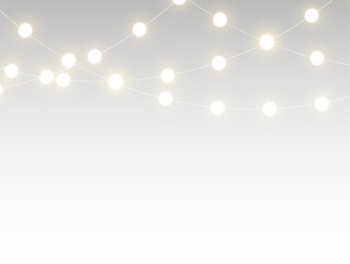 Obraz premium Golden christmas garland glowing with bright festive lights and decorative chain illumination creating a transparent horizontal border perfect for winter holiday cards, banners, and celebration design