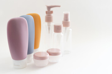 empty travel multi-colored cosmetic bottles