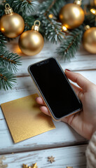 A man holding a mobile phone on a white background reflects the spirit of the festive season - the concept of winter and Christmas holidays.