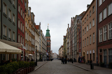 View of a cobblestone street lined with colorful historic buildings in the Old Town of Gdańsk, Poland