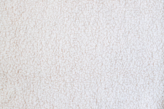 Soft cream sherpa fleece texture for winter clothing, blankets, upholstery, or background use in design projects