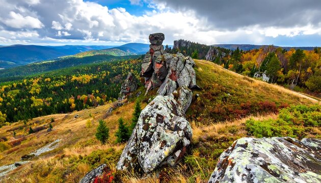 Picturesque autumn scenery showcasing a rugged rock formation atop a hill with vibrant foliage and mountain views under a cloudy sky - Powered by Adobe