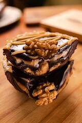 A rich and indulgent chocolate spoon egg layered with creamy filling and drizzled with caramel and chocolate. Topped with crunchy walnuts, it offers a perfect balance of texture and flavor, ideal for 