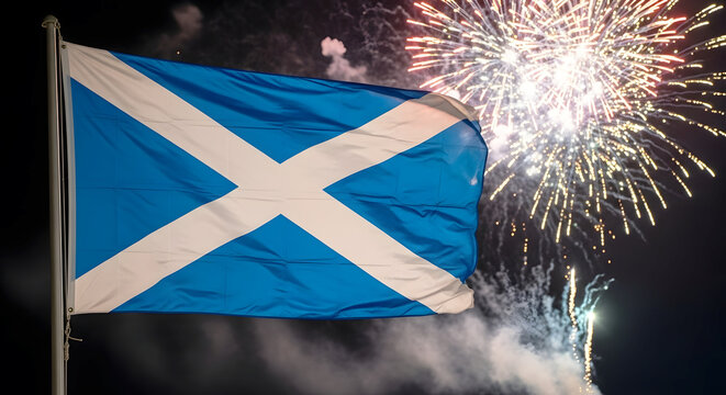 Scottish flag waving during fireworks display at night