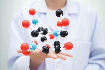 Scientist holding Petri dish with meat in science laboratory for food product development.