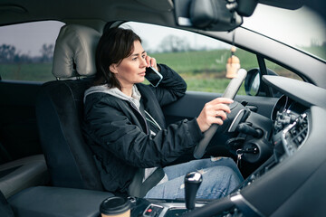 Woman Driver Taking A Phone Talk During A Long Car Trip