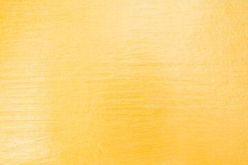 Gold color cement wall texture background.