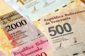 Venezuelan Bolivar currency money bills in big amount. Pile of VED currency banknotes with different denomination close up
