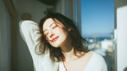 Smiling woman enjoying fresh morning sunlight with relaxed and positive mood