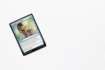 Obraz premium Bradford, UK Nov 3 2025 Unstable Experiment card from the Spider-man magic the gathering card game shot isolated on a white paper background.