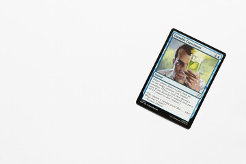 Obraz premium Bradford, UK Nov 3 2025 Unstable Experiment card from the Spider-man magic the gathering card game shot isolated on a white paper background.