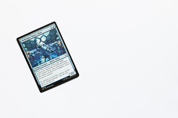Obraz premium Bradford, UK Nov 3 2025 Alchemax Slayer-Bots card from the Spider-man magic the gathering card game shot isolated on a white paper background.