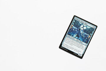 Obraz premium Bradford, UK Nov 3 2025 Alchemax Slayer-Bots card from the Spider-man magic the gathering card game shot isolated on a white paper background.