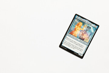 Obraz premium Bradford, UK Nov 3 2025 Lyla, Holographic Assistant card from the Spider-man magic the gathering card shot isolated on a white paper background.