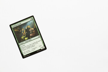 Naklejka premium Bradford, UK Nov 3 2025 Lurking Lizards card from Spider-man magic the gathering card game shot isolated on a white paper background.