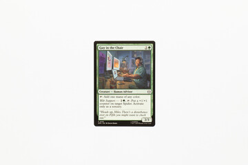 Naklejka premium Bradford, UK Nov 3 2025 Guy in the Chair card from Spider-man magic the gathering card game shot isolated on a white paper background.