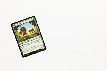 Naklejka premium Bradford, UK Nov 3 2025 Kraven's Cats card from Spider-man magic the gathering card game shot isolated on a white paper background.