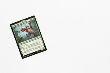 Naklejka premium Bradford, UK Nov 3 2025 Spider-Rex, Daring Dino card from Spider-man magic the gathering shot isolated on a white paper background.
