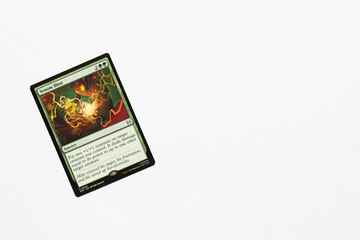 Naklejka premium Bradford, UK Nov 3 2025 Venom Blast card from Spider-man magic the gathering shot isolated on a white paper background.