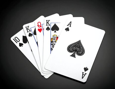 A poker hand shows five playing cards in a royal flush, resting on a black surface. The cards are crisp and clear - Powered by Adobe
