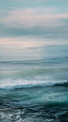 Fototapeta premium Blue ocean water with foamy waves under a calm cloudy sky horizon.
