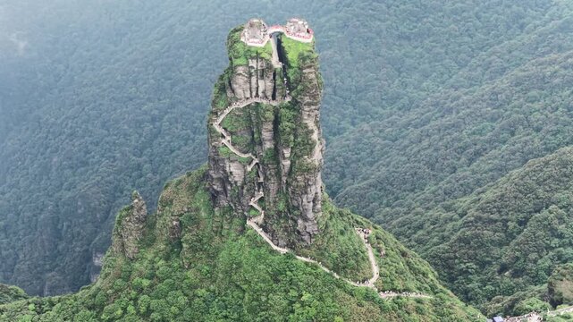 Aerial view of the majestic Fanjingshan mountain with winding paths leading to the temple at the summit, Fanjingshan, Guizhou, China.