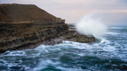Filey Brigg, waves crashing on the shore