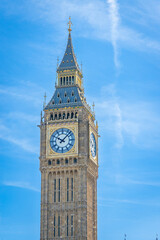 Close-up of Big Ben clock face under bright sunlight in London on a sunny day