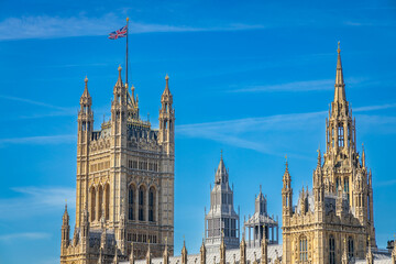 Obraz premium Palace of Westminster, with the Victoria Tower at left and the central spire of the building at the tight in London, UK