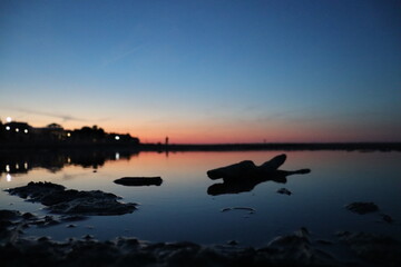 Sea sunset with shadow reflection in the river